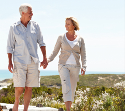 old couple walking with hand holding